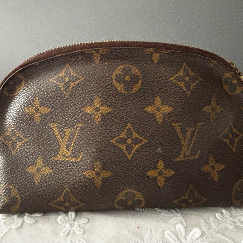 Louis Vuitton Cosmetic Bag.  Has makeup smudges in interior of bag.